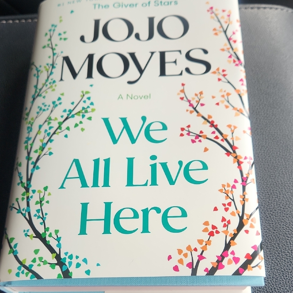 Hardcover Book We All Live Here By JOJO MOYES